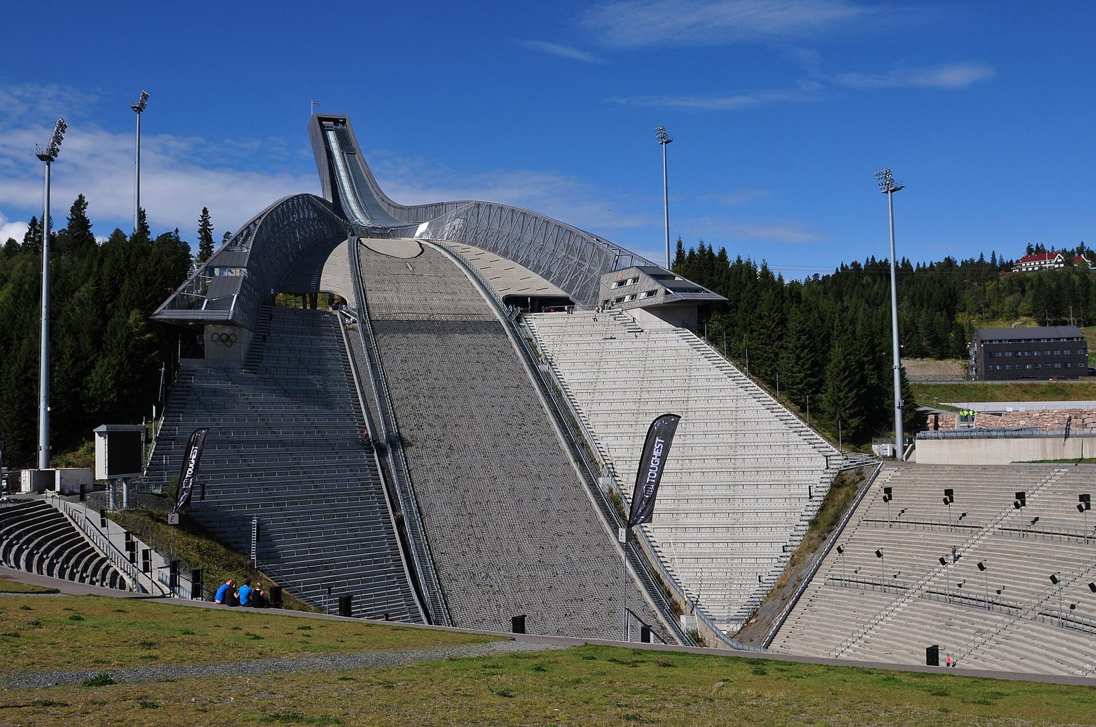 The Holmenkollen ski jump rising above the forested hills of Oslo