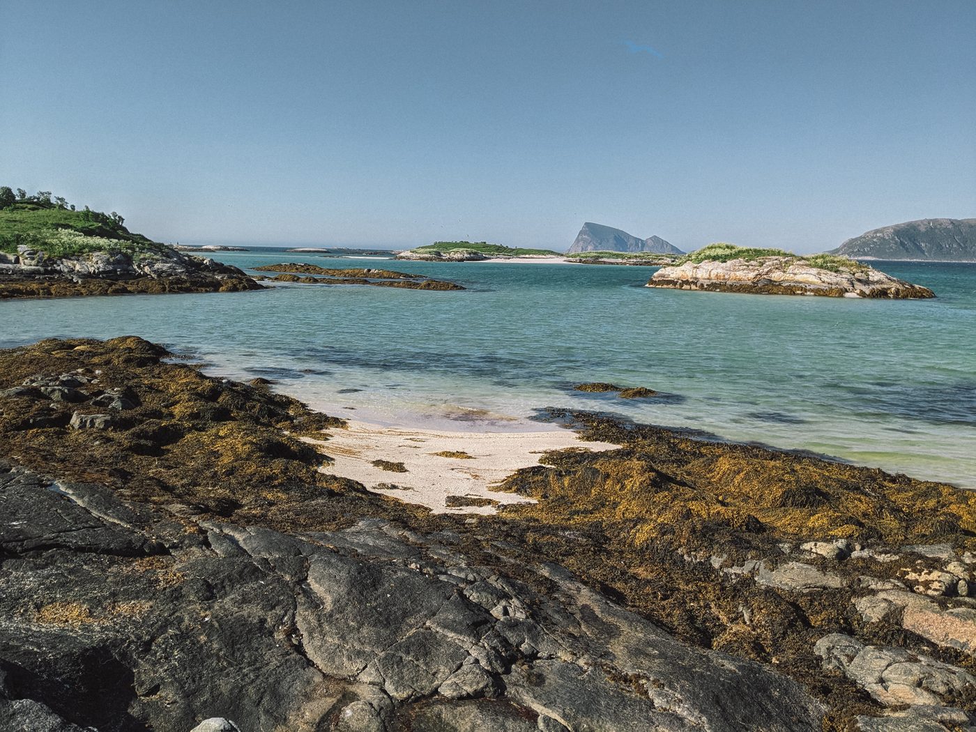 White-sand beaches and turquoise water at Sommarøy near Tromsø in the Arctic summer