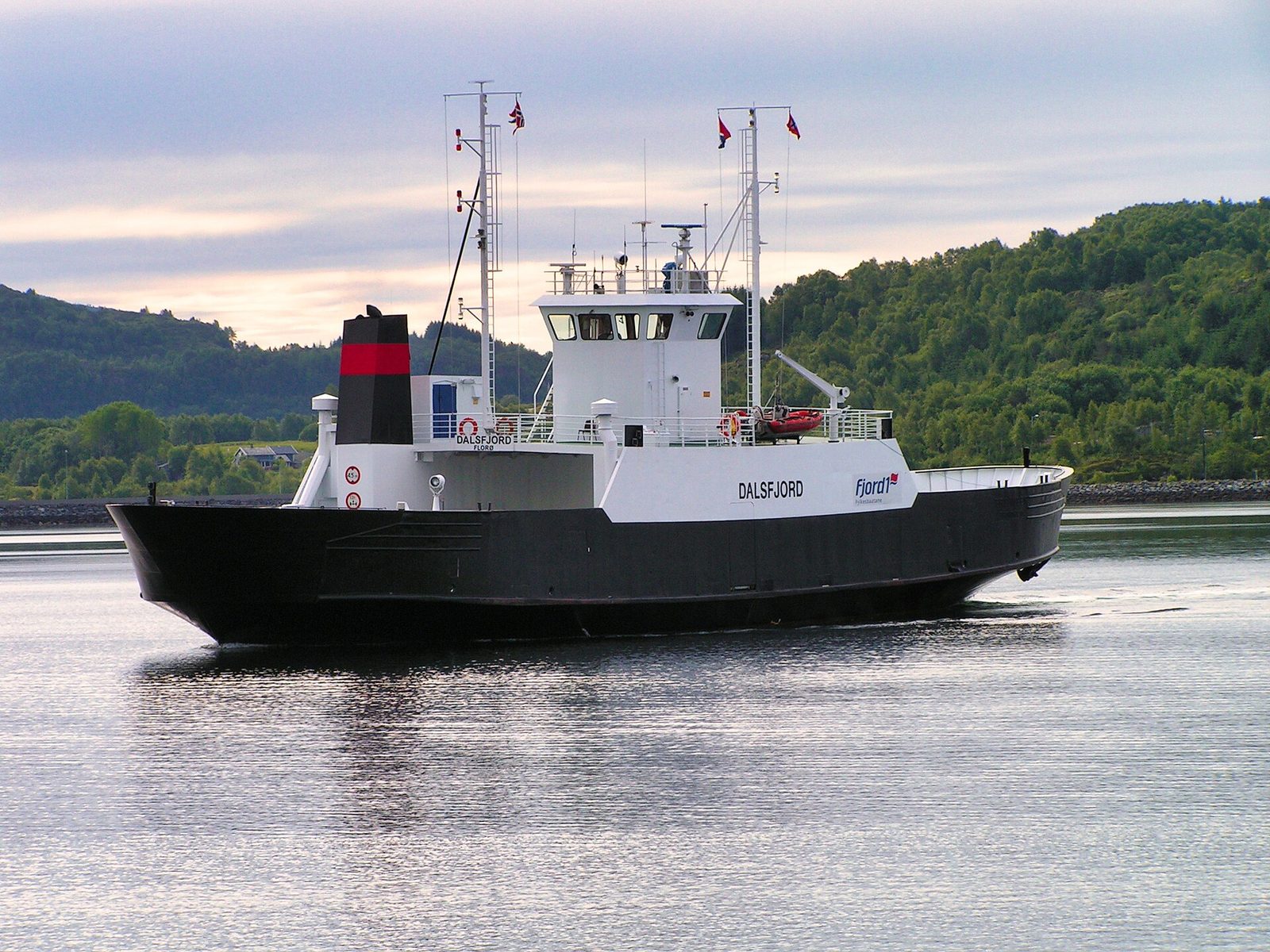 A car ferry crossing a Norwegian fjord