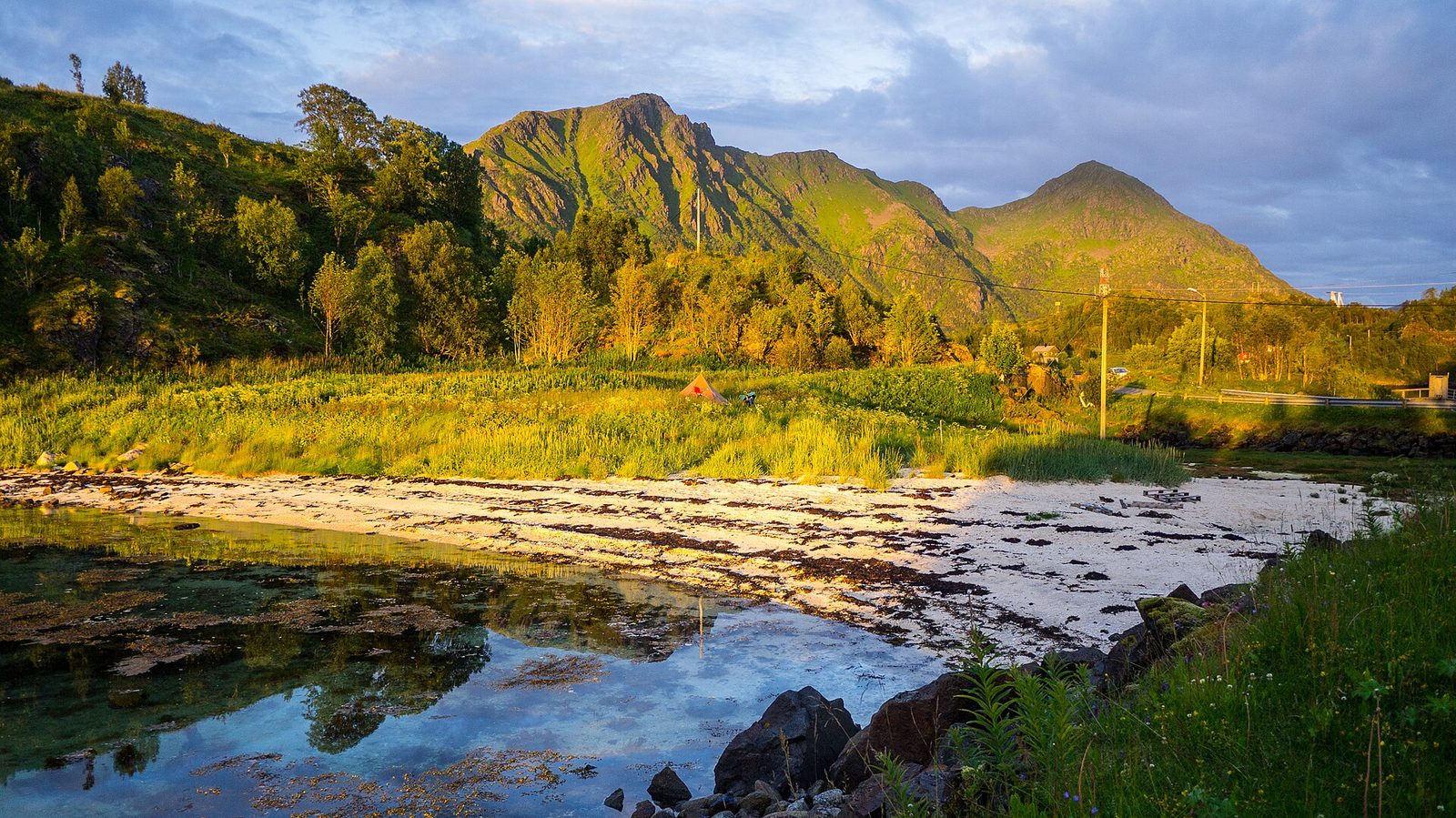 The golden light of a summer midnight sun over Hanoy in Vesteralen, northern Norway