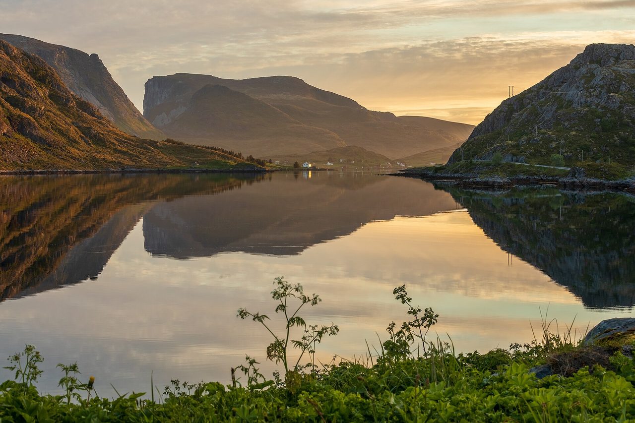 Long golden summer light over the peaks of the Lofoten Islands