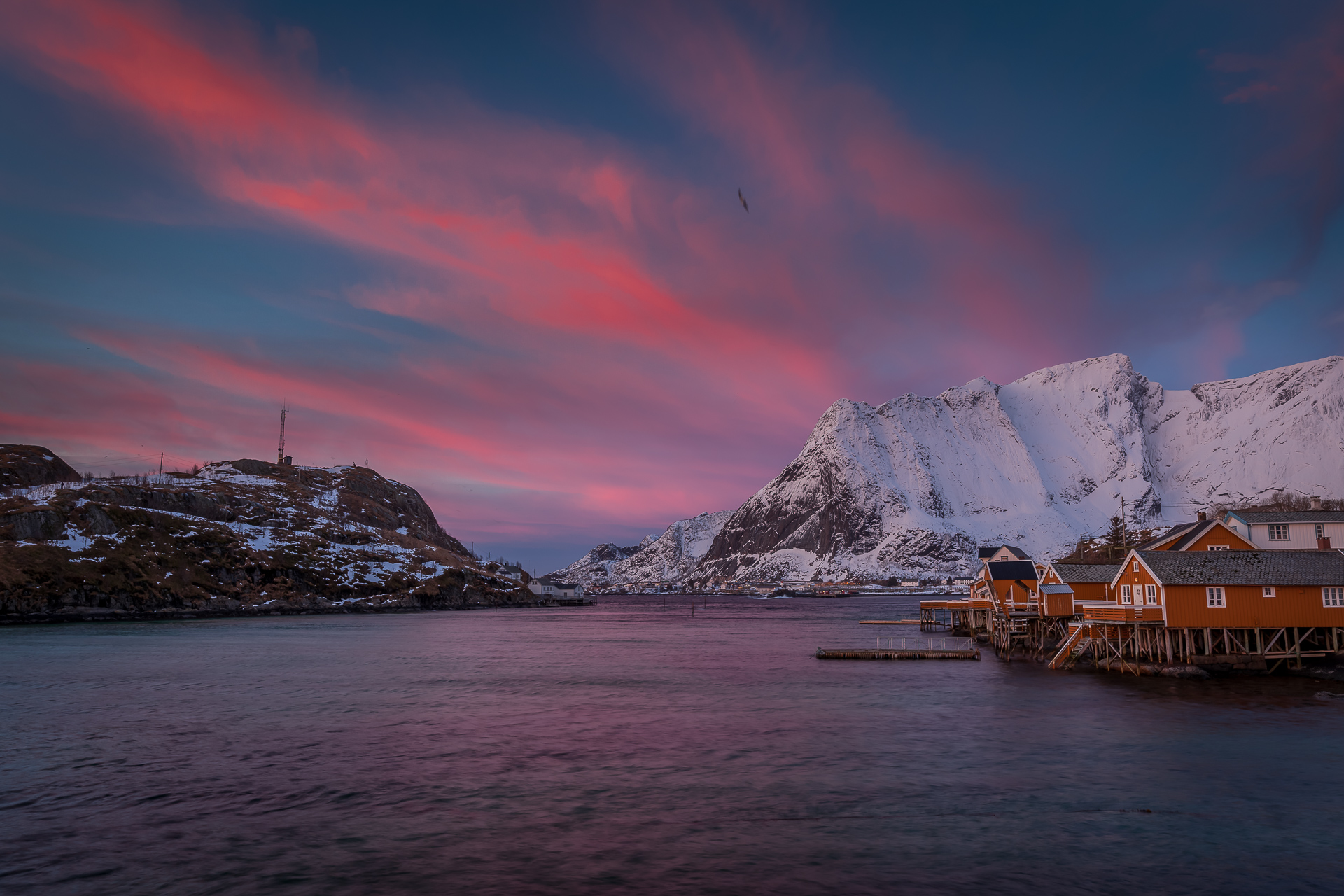 Yellow rorbu cabins on stilts at Sakrisøy in Lofoten — for many travellers deciding where to stay in Norway, a night in a rorbu tops the list