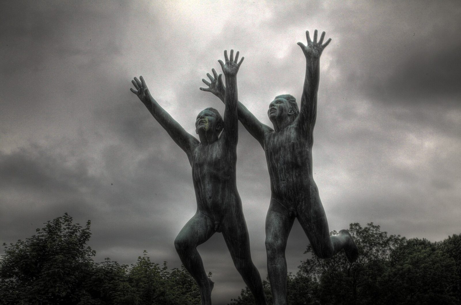 Bronze figures reaching skyward among the sculptures of Vigeland Sculpture Park in Oslo