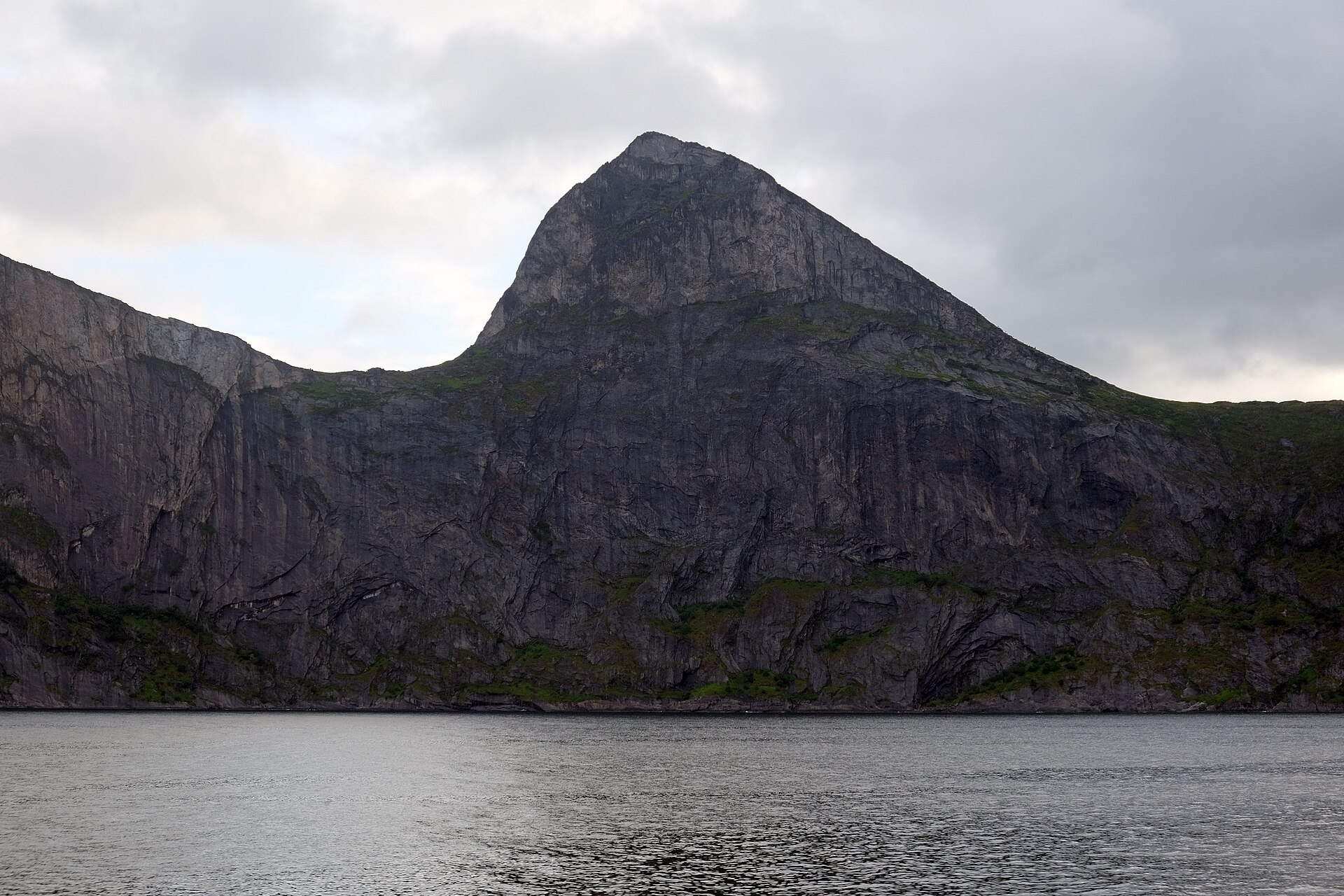 The overhanging prow of the Segla peak rising above the fjord on Senja island, northern Norway