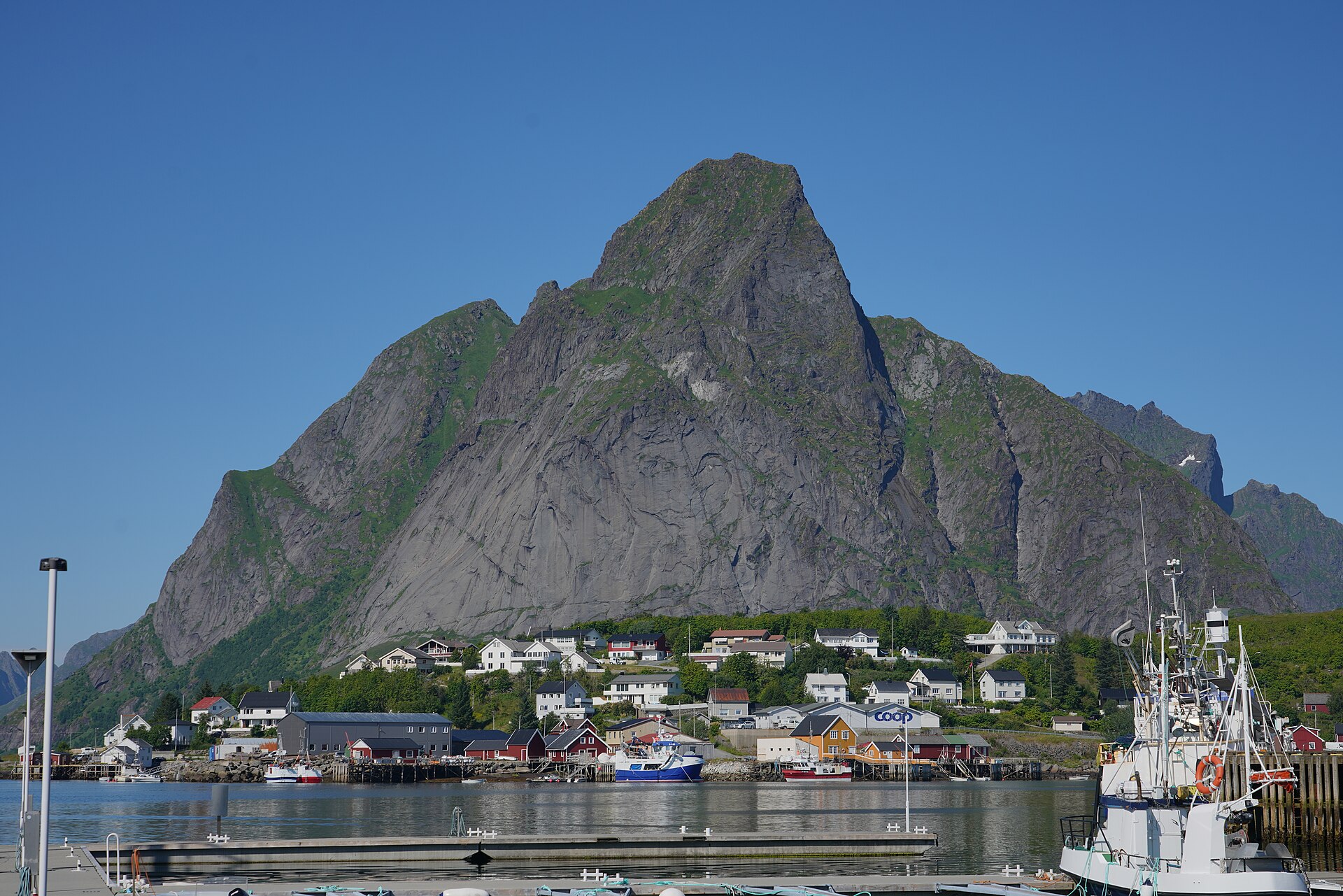 The village of Reine beneath the Olstinden peak in the Lofoten Islands, Norway