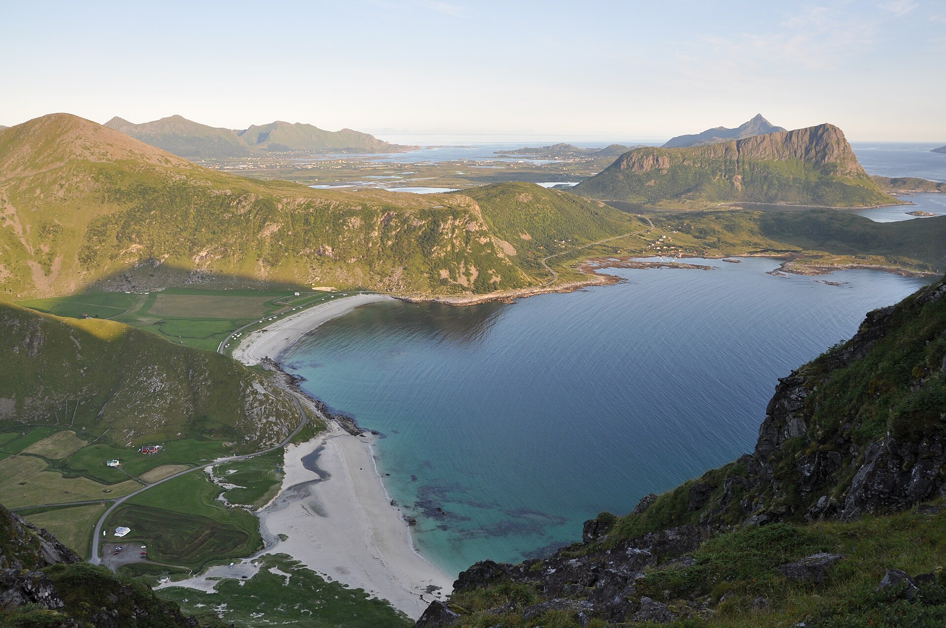 The white sand and turquoise water of Haukland beach in the Lofoten Islands, a good stop when visiting Norway with kids